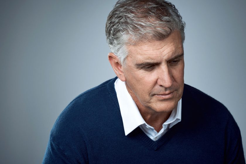 Studio shot of a mature man looking sad against a grey background